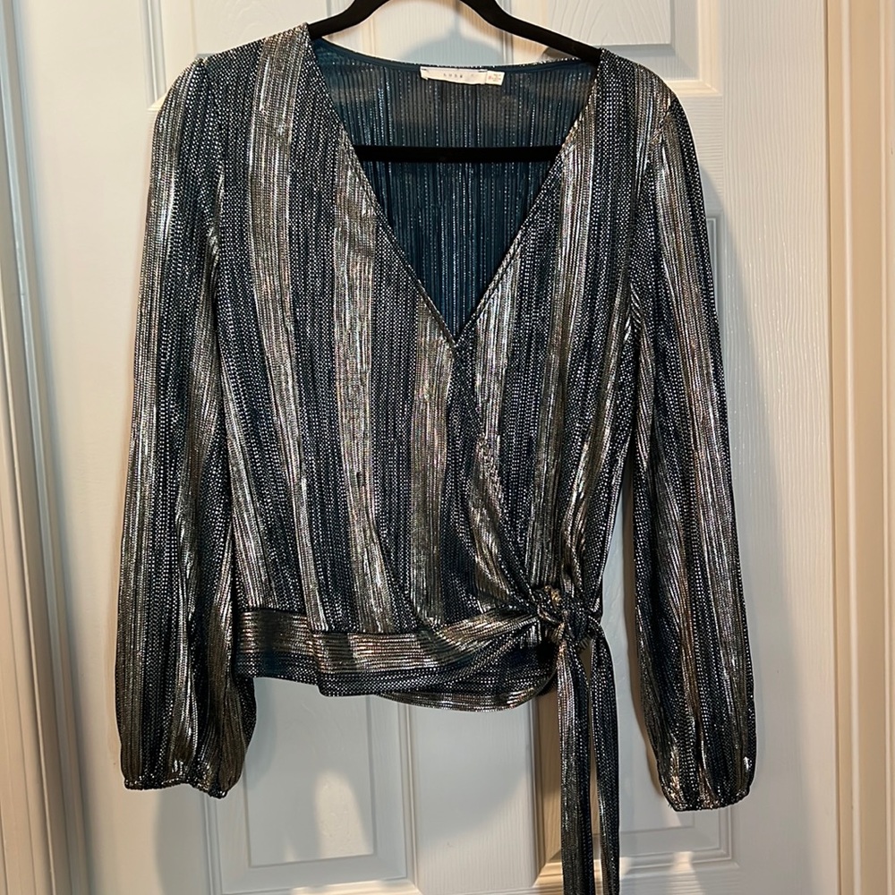 Green/silver/gold metallic wrap shirt with tie waist. Size medium